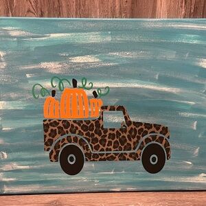 Cute leopard farm truck with pumpkins